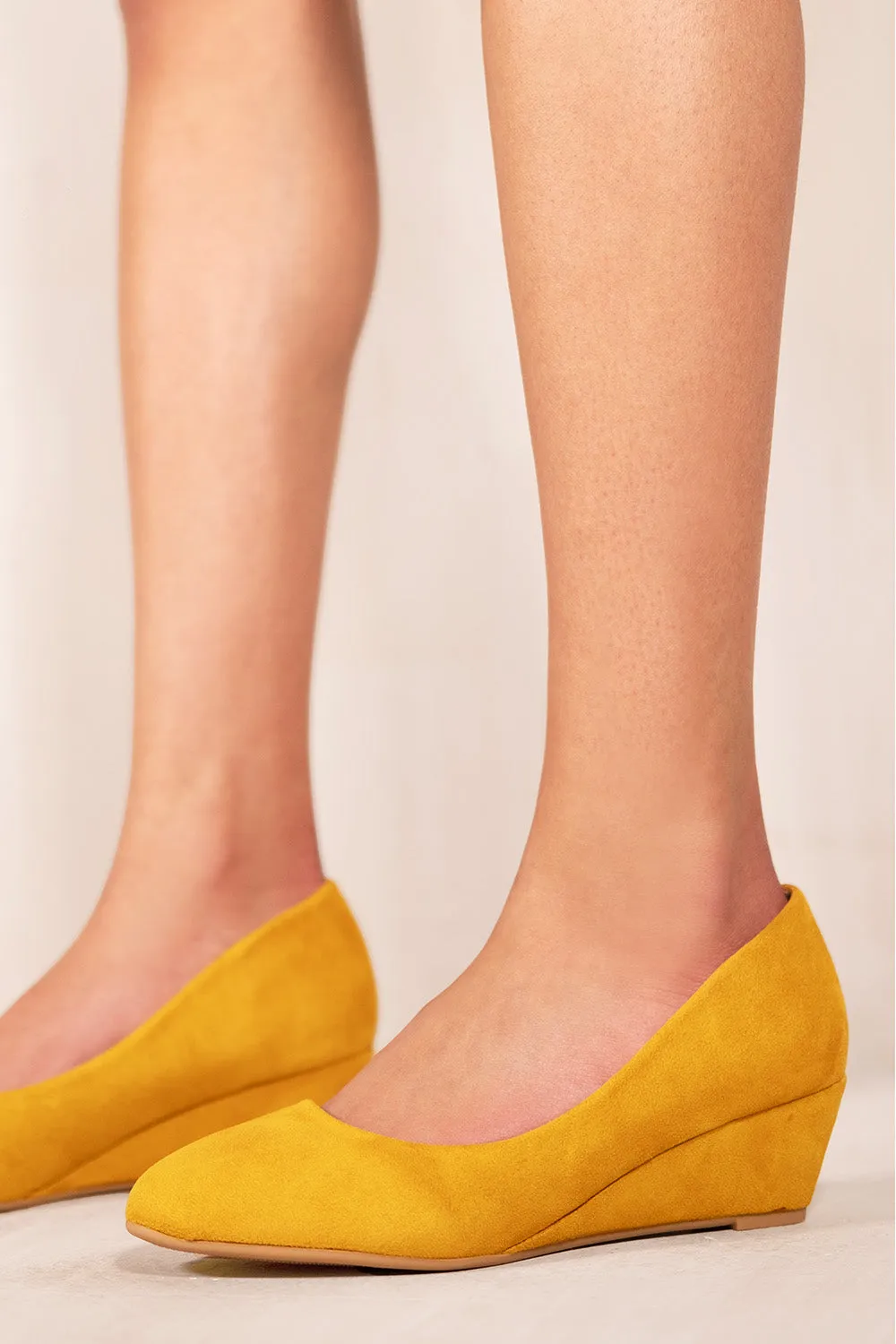 KIERAN PLATFORM LOW WEDGE MID HEEL COURT SHOES IN YELLOW SUEDE